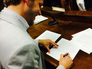Clarkston Mayor Ted Terry signs Welcoming resolution